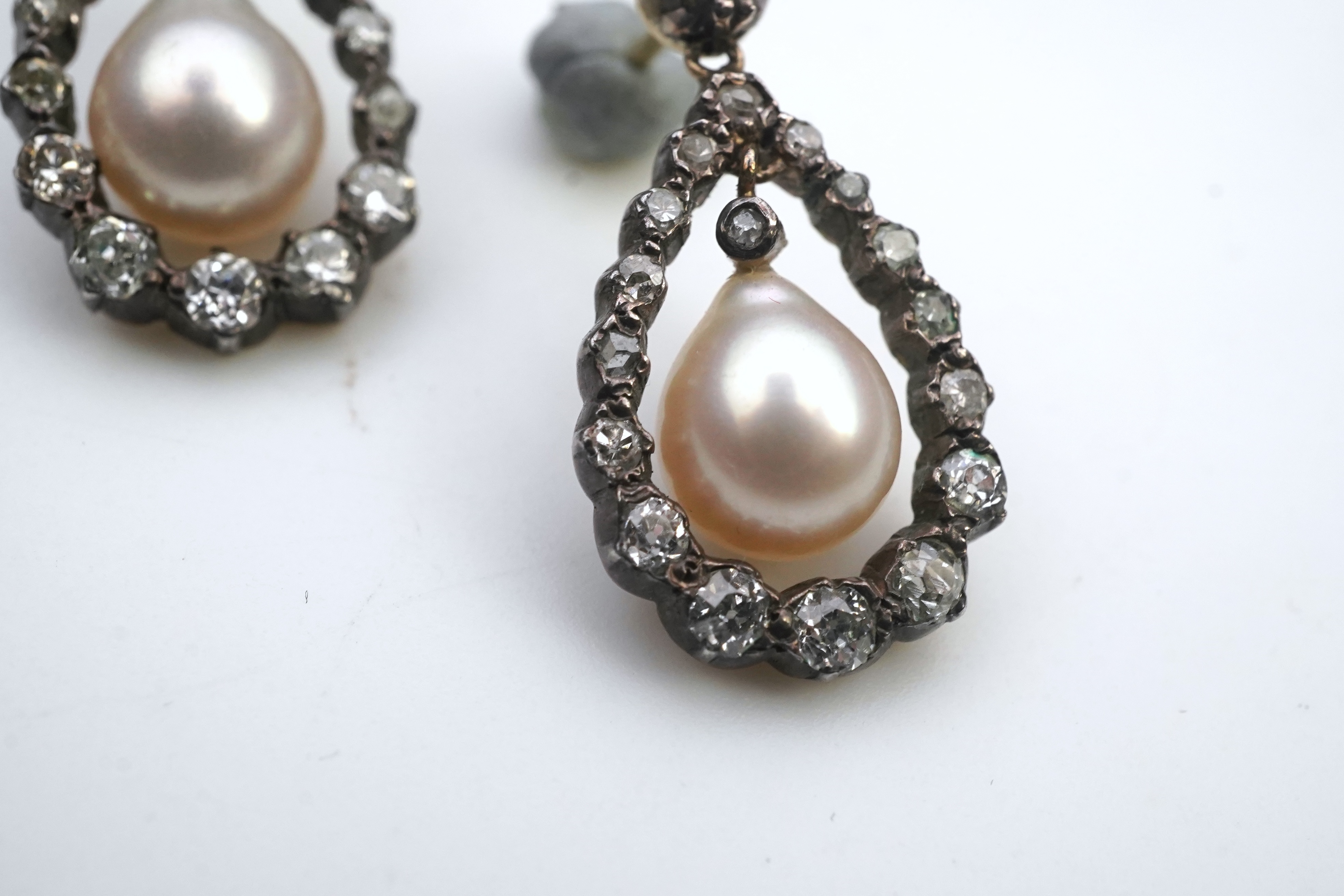 A pair of cultured pearl and diamond earrings